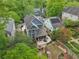 Aerial view of backyard with a fire pit, screened porch and lush garden beds at 424 Melrose Ave, Decatur, GA 30030
