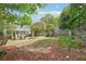 Large backyard with a firepit, patio, and screened porch perfect for enjoying the outdoors at 424 Melrose Ave, Decatur, GA 30030