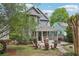 Inviting backyard with a firepit, patio, screened porch and lush greenery for relaxation and outdoor entertaining at 424 Melrose Ave, Decatur, GA 30030