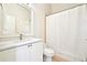 Bathroom with white vanity, white toilet, and shower with curtain at 424 Melrose Ave, Decatur, GA 30030