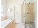 Spacious bathroom with a glass-enclosed shower and luxurious soaking tub at 424 Melrose Ave, Decatur, GA 30030