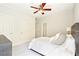 Comfortable bedroom with neutral tones, white bedding, and a ceiling fan at 424 Melrose Ave, Decatur, GA 30030