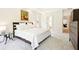 Well-lit bedroom features neutral tones and a view into the en suite bathroom at 424 Melrose Ave, Decatur, GA 30030