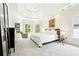 Bright bedroom featuring a tray ceiling, neutral carpet, and ample natural light at 424 Melrose Ave, Decatur, GA 30030