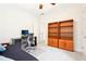 Bright bedroom featuring bookshelves, a desk, and a comfortable futon at 424 Melrose Ave, Decatur, GA 30030