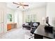 Cozy bedroom features a ceiling fan, built-in desk, and large windows at 424 Melrose Ave, Decatur, GA 30030