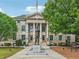 Exterior view of the historic DeKalb County Courthouse, featuring classical architecture and manicured landscaping at 424 Melrose Ave, Decatur, GA 30030