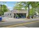 Street view of a commercial building with large windows, street parking, and outdoor seating at 424 Melrose Ave, Decatur, GA 30030