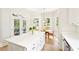 Bright kitchen with white cabinetry and stainless steel appliances featuring backyard views at 424 Melrose Ave, Decatur, GA 30030