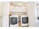Convenient laundry room with washer, dryer, and overhead cabinets at 424 Melrose Ave, Decatur, GA 30030