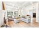 Spacious living room with hardwood floors, fireplace, and abundant natural light at 424 Melrose Ave, Decatur, GA 30030