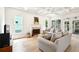 Bright living room with fireplace, hardwood floors, coffered ceiling, and backyard access at 424 Melrose Ave, Decatur, GA 30030