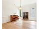 Elegant living room boasts hardwood floors, large windows, and a charming piano at 424 Melrose Ave, Decatur, GA 30030