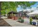 Outdoor seating at The Marlay with a brick pergola and tent covered area at 424 Melrose Ave, Decatur, GA 30030