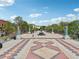 View of Decatur town square with patterned pavers, trees, benches, and a central fountain at 424 Melrose Ave, Decatur, GA 30030