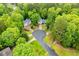 Aerial view of neighborhood homes and landscaping from above at 4822 Westbourne Dr, Powder Springs, GA 30127