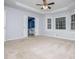 Primary bedroom featuring generous space, tray ceilings, and plenty of natural light at 4822 Westbourne Dr, Powder Springs, GA 30127