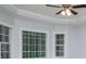 Bedroom with crown molding, ceiling fan and large windows that provide natural lighting at 4822 Westbourne Dr, Powder Springs, GA 30127