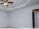 Bedroom with a ceiling fan and open doorway to the bathroom at 4822 Westbourne Dr, Powder Springs, GA 30127