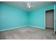 Bedroom with turquoise walls, a window, carpet, and a ceiling fan at 4822 Westbourne Dr, Powder Springs, GA 30127