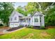 Charming gray two-story home with blue shutters, two-car garage, and well-maintained landscaping at 4822 Westbourne Dr, Powder Springs, GA 30127