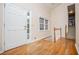 Inviting foyer featuring hardwood floors, a staircase, and a bright window to the outside at 4822 Westbourne Dr, Powder Springs, GA 30127