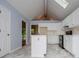 Bright kitchen featuring white cabinets, a central island, updated appliances, and marble-look flooring at 4822 Westbourne Dr, Powder Springs, GA 30127