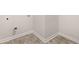 An unfinished basement area with a floor, showcasing its potential for customization and additional living space at 339 Elgin Dr, Lawrenceville, GA 30045