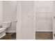 Bathroom with hardwood floors, a toilet, and a wire rack shelf at 339 Elgin Dr, Lawrenceville, GA 30045