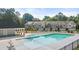Community pool with ample deck space for lounge chairs and relaxation at 339 Elgin Dr, Lawrenceville, GA 30045