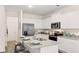 Modern kitchen with white cabinets, stainless appliances, and granite countertops at 339 Elgin Dr, Lawrenceville, GA 30045