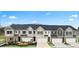 View of new townhomes with two-car garages and professionally landscaped yards at 339 Elgin Dr, Lawrenceville, GA 30045