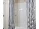 Bathroom featuring a tiled shower/tub and modern shower curtain at 5128 Noble Village Way # 35, Lilburn, GA 30047