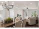 Open dining and living room area with modern decor at 5128 Noble Village Way # 35, Lilburn, GA 30047