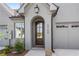Inviting front entrance with a handsome wood door and brick facade for a touch of timeless elegance at 5128 Noble Village Way # 35, Lilburn, GA 30047