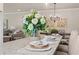 Granite kitchen island with decorations including plates and flowers at 5128 Noble Village Way # 35, Lilburn, GA 30047