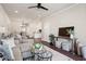Open-concept living area with hardwood floors, a comfortable seating area, and easy access to the kitchen at 5128 Noble Village Way # 35, Lilburn, GA 30047