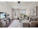 Cozy living room with plush seating, ceiling fan, and an open layout perfect for relaxation at 5128 Noble Village Way # 35, Lilburn, GA 30047
