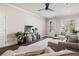 Bright living area featuring neutral tones, wood floors, and comfortable seating arrangement near the entryway at 5128 Noble Village Way # 35, Lilburn, GA 30047
