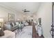 Sunlit living room features hardwood floors and a comfortable seating area with stylish decor at 5128 Noble Village Way # 35, Lilburn, GA 30047