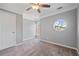 Bedroom featuring a ceiling fan and a round window adding natural light to the neutral space at 1530 Wehunt Se Cir # 19, Smyrna, GA 30082