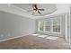 Bedroom featuring large windows, a ceiling fan, and neutral carpet at 1530 Wehunt Se Cir # 19, Smyrna, GA 30082