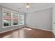 Bright bedroom with hardwood floors, ceiling fan and multiple windows overlooking trees at 1530 Wehunt Se Cir # 19, Smyrna, GA 30082