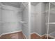 Walk-in closet with carpet and white shelving that provides plenty of storage space at 1530 Wehunt Se Cir # 19, Smyrna, GA 30082