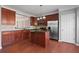 Stylish kitchen featuring stainless steel appliances, granite countertops, and center island at 1530 Wehunt Se Cir # 19, Smyrna, GA 30082