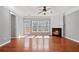 Bright living room featuring a fireplace, large windows, and a ceiling fan at 1530 Wehunt Se Cir # 19, Smyrna, GA 30082