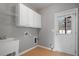 Mudroom with sink, storage cabinets, a utility closet and door that leads outside at 1530 Wehunt Se Cir # 19, Smyrna, GA 30082