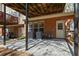 View of the concrete patio featuring the exterior brick and utility access of this charming home at 1530 Wehunt Se Cir # 19, Smyrna, GA 30082