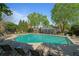 Community swimming pool with plenty of lounge chairs and green trees, providing a relaxing atmosphere at 1530 Wehunt Se Cir # 19, Smyrna, GA 30082
