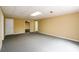 Open basement with carpet, neutral paint, and doorways leading to other rooms in the basement at 2055 Springer Walk, Lawrenceville, GA 30043